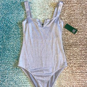 Silver bodysuit with snap closure